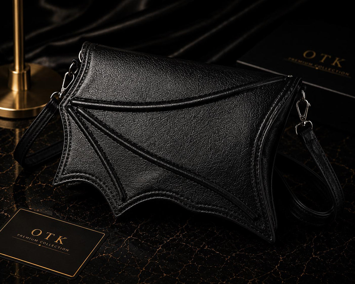 Black bat wing crossbody bag in vegan leather with detachable shoulder strap, OTK Premium Collection