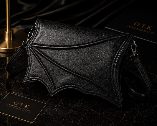Black bat wing crossbody bag in vegan leather with detachable shoulder strap, OTK Premium Collection